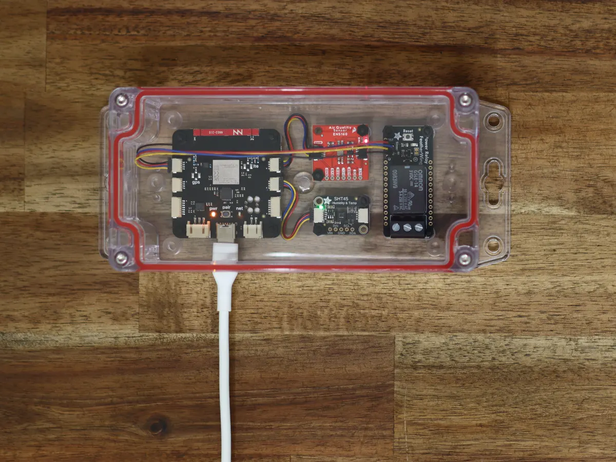An S2 Module air quality monitor: the S2 and two sensor boards in a clear sealed enclosure, powered over USB-C